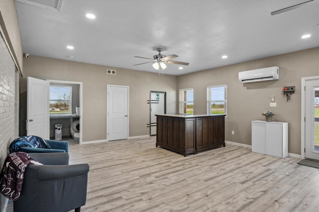 16159 County Road 347 Wills Point, TX 75169 - Photo 15 of 38 a view of a livingroom with furniture wooden floor and a ceiling fan