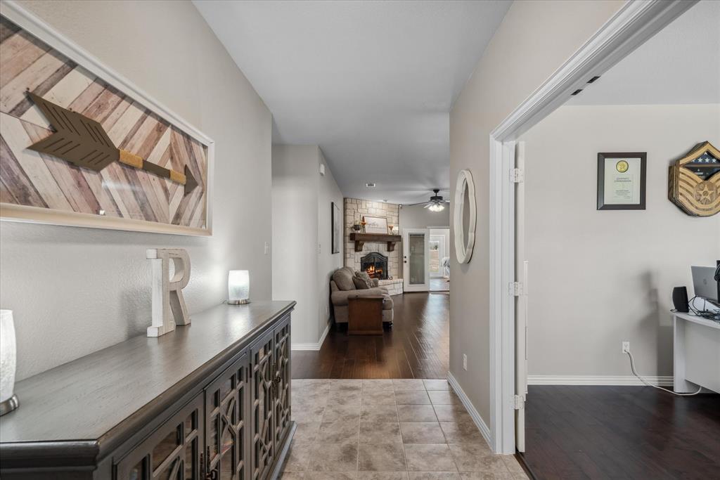 16159 County Road 347 Wills Point, TX 75169 - Photo 16 of 38 a kitchen with stainless steel appliances kitchen island granite countertop a refrigerator a sink a stove and white cabinets