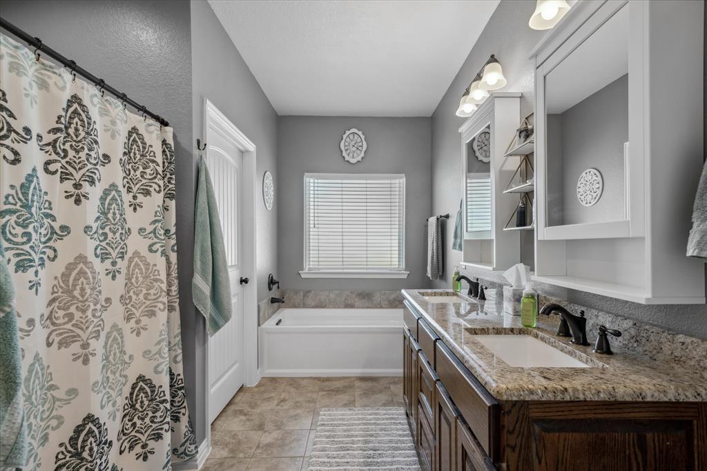 16159 County Road 347 Wills Point, TX 75169 - Photo 21 of 38 a bathroom with a granite countertop sink and a mirror