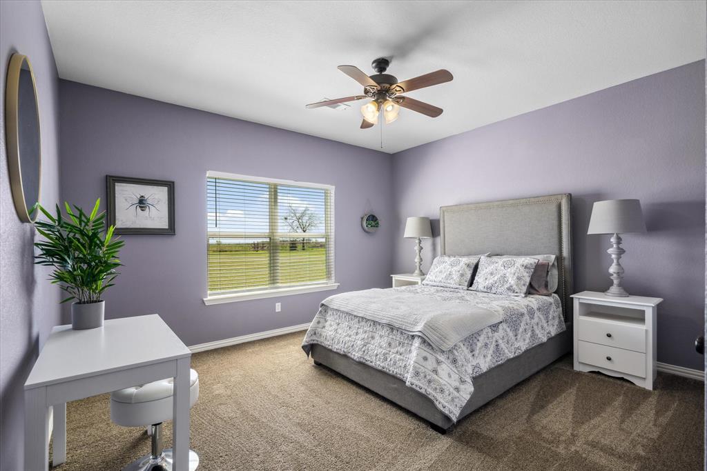 16159 County Road 347 Wills Point, TX 75169 - Photo 23 of 38 a bedroom with a large bed and a window