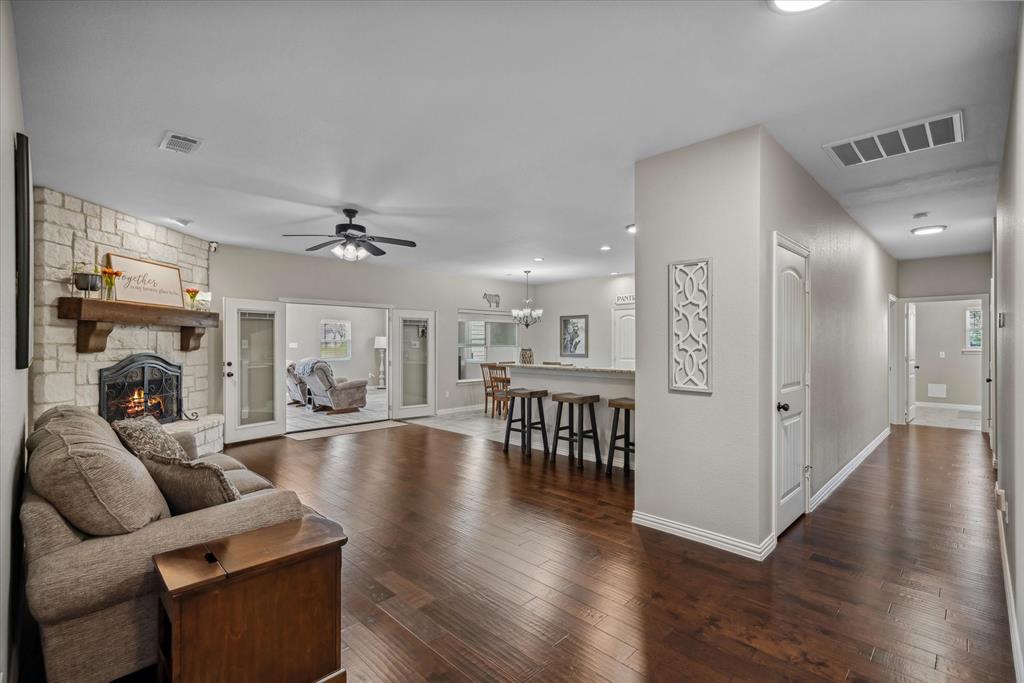 16159 County Road 347 Wills Point, TX 75169 - Photo 10 of 38 a living room with furniture or wooden floor and a fireplace
