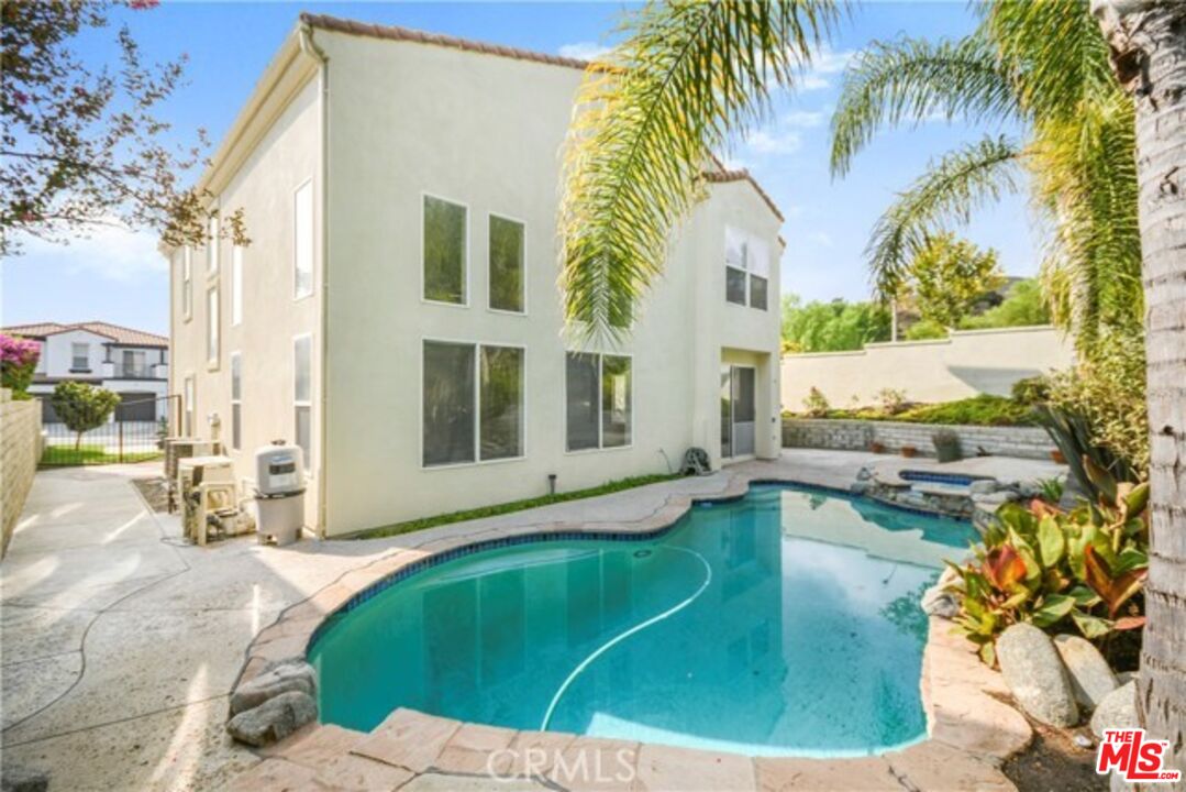 a view of a house with swimming pool