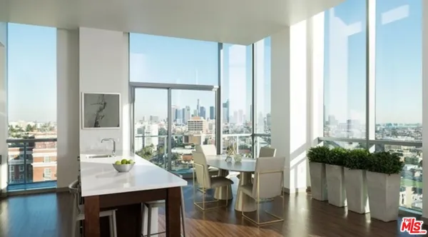 a view of a dining room with furniture window and wooden floor