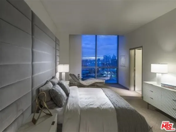 a bedroom with a bed and a closet