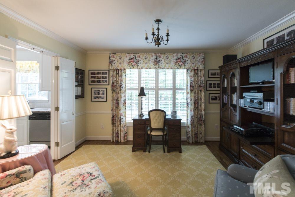 4032 Nottaway Road Durham, NC 27707 - Photo 8 of 25 Formerly the Dining Room, this cozy den has a lovely view of the tranquil fenced backyard.