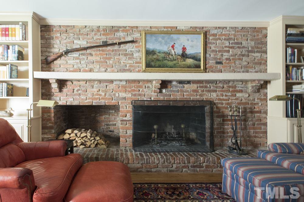 4032 Nottaway Road Durham, NC 27707 - Photo 10 of 25 A cozy setting for enjoying relaxing by the fire. Also, the family room provides access to the extra large deck overlooking a flat, private backyard.