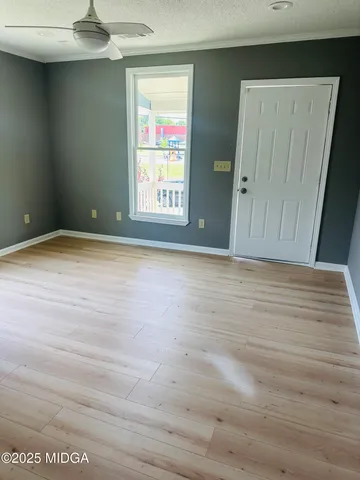 a view of an empty room with a window