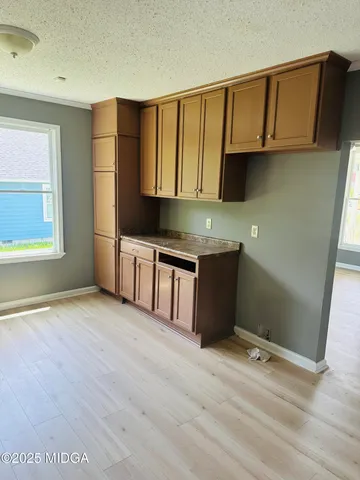 a kitchen with stainless steel appliances granite countertop a stove a microwave and a refrigerator