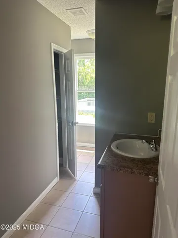 a bathroom with a sink and a toilet