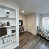 a view of kitchen with furniture and wooden floor