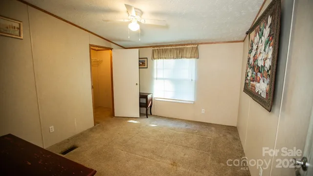 a picture of a floor to ceiling window and brick wall