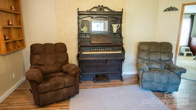 a living room with furniture and a window