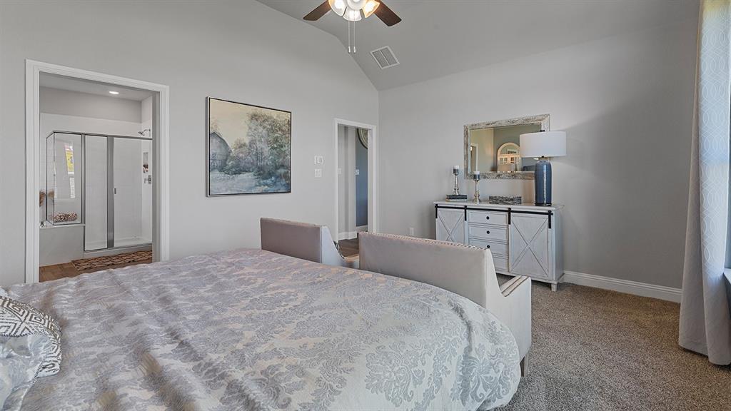 3280 Pier View Street Midlothian, TX 76065 - Photo 16 of 37 a bedroom with a bed and a lamp on table