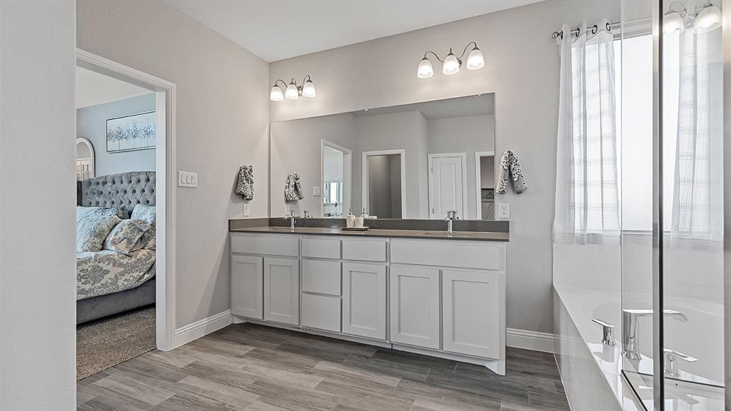 3280 Pier View Street Midlothian, TX 76065 - Photo 19 of 37 a bathroom with a double vanity sink and a mirror