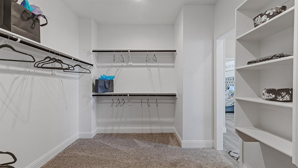 3280 Pier View Street Midlothian, TX 76065 - Photo 20 of 37 a view of walk in closet with empty racks