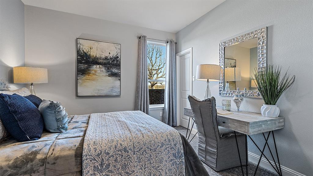 3280 Pier View Street Midlothian, TX 76065 - Photo 22 of 37 a bedroom with a bed and a table in it