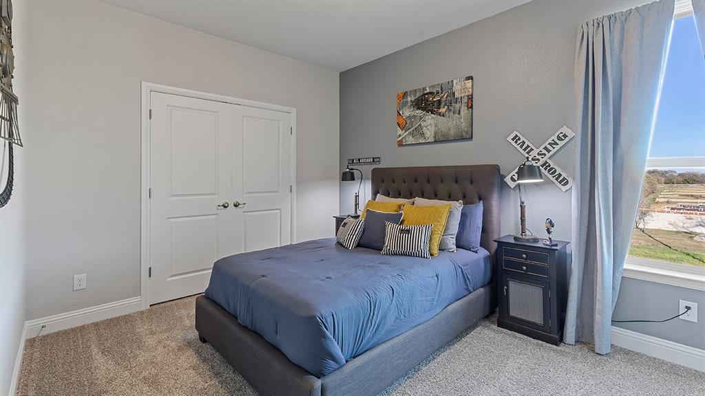 3280 Pier View Street Midlothian, TX 76065 - Photo 32 of 37 a bedroom with a bed and a painting on the wall