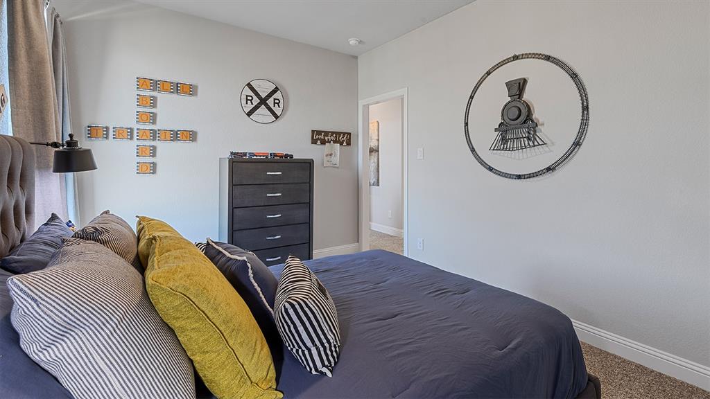 3280 Pier View Street Midlothian, TX 76065 - Photo 33 of 37 a bedroom with a bed and a mirror