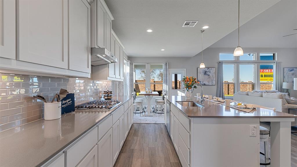 3280 Pier View Street Midlothian, TX 76065 - Photo 6 of 37 a kitchen with counter top space and wooden floor