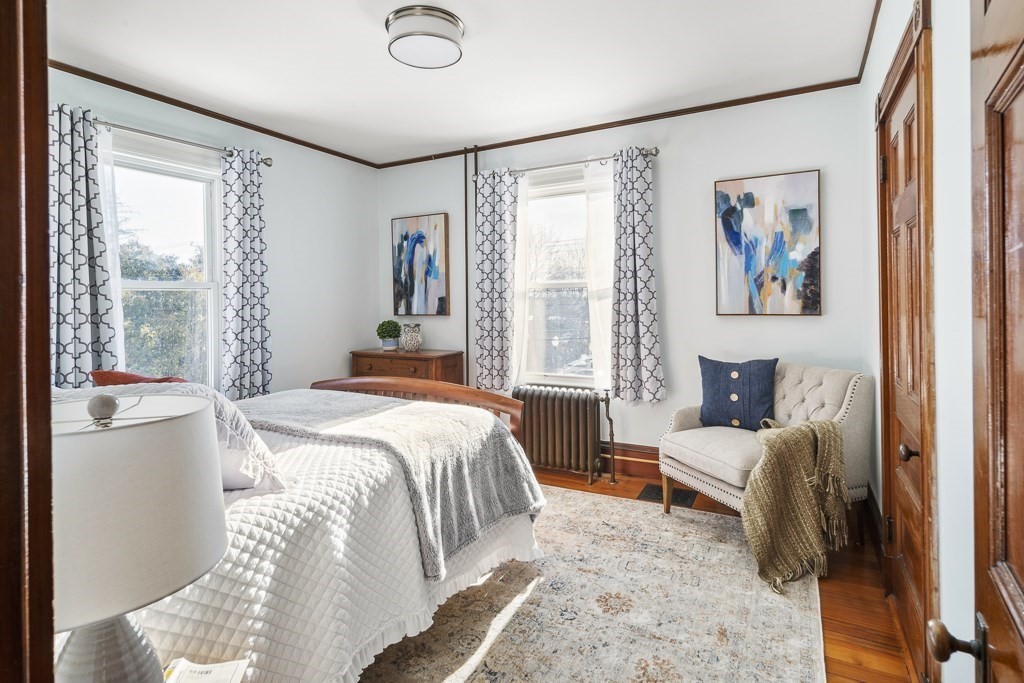 44 Mark Lee Road Needham, MA 02494 - Photo 15 of 33 a bedroom with a bed and a painting on the wall