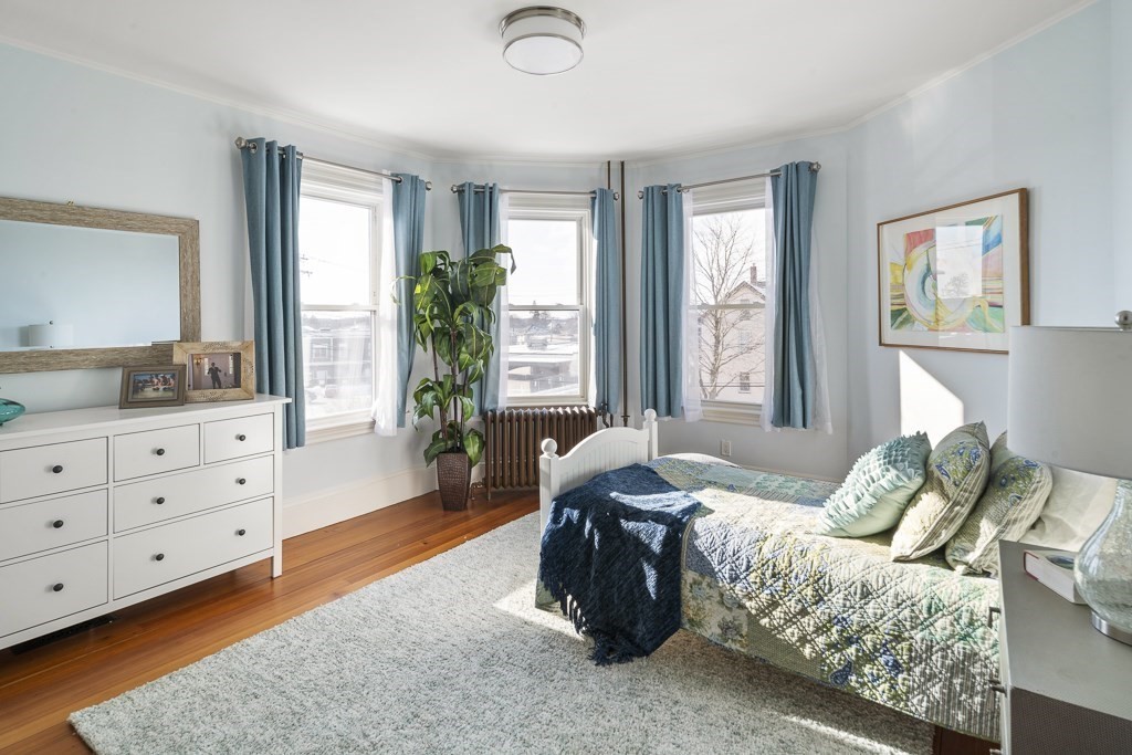 44 Mark Lee Road Needham, MA 02494 - Photo 16 of 33 a spacious bedroom with a bed and window