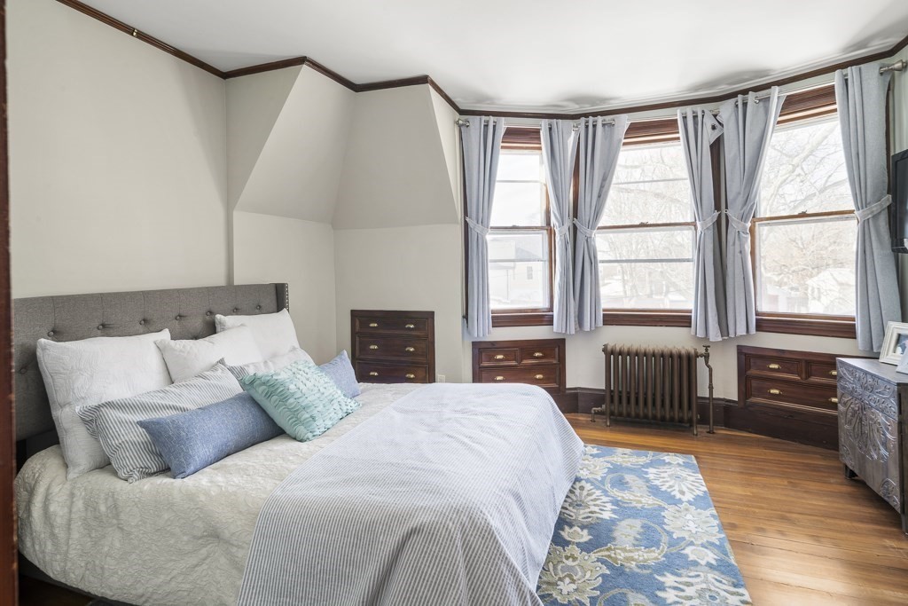 44 Mark Lee Road Needham, MA 02494 - Photo 18 of 33 a bedroom with a bed and wooden floor