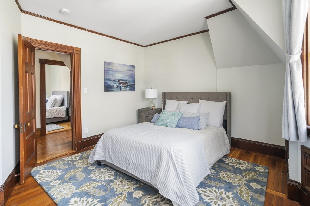 44 Mark Lee Road Needham, MA 02494 - Photo 19 of 33 a bedroom with a bed and wooden floor
