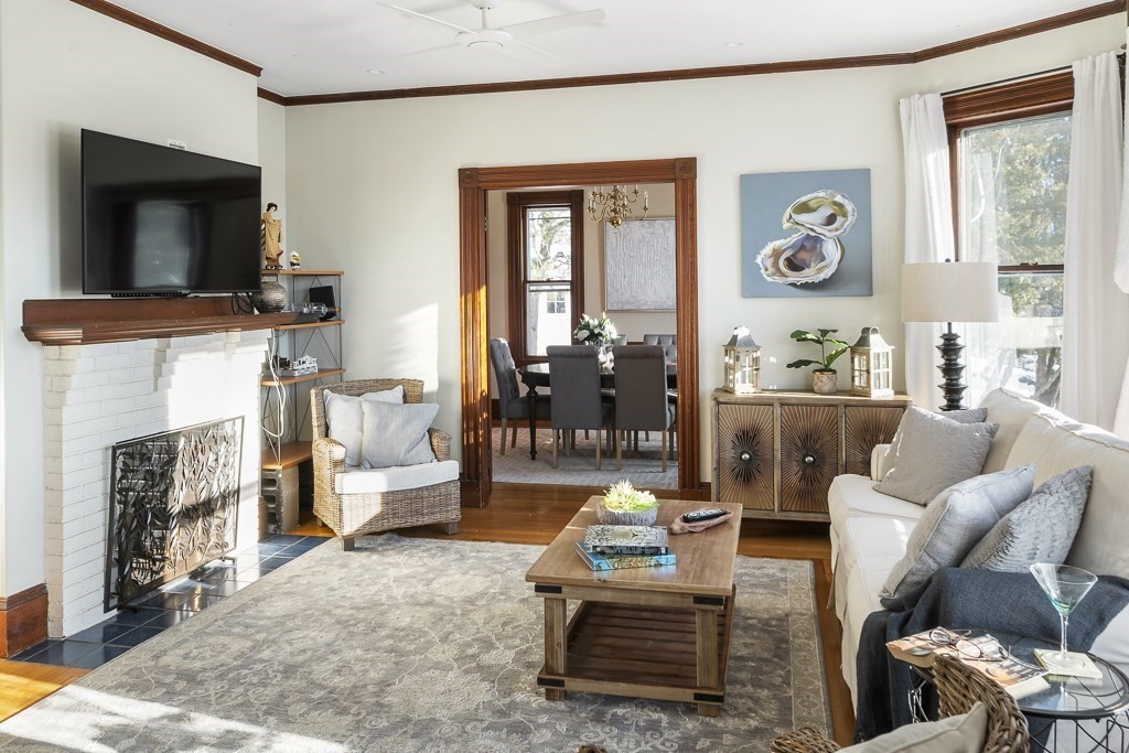 44 Mark Lee Road Needham, MA 02494 - Photo 6 of 33 a living room with furniture and a fireplace