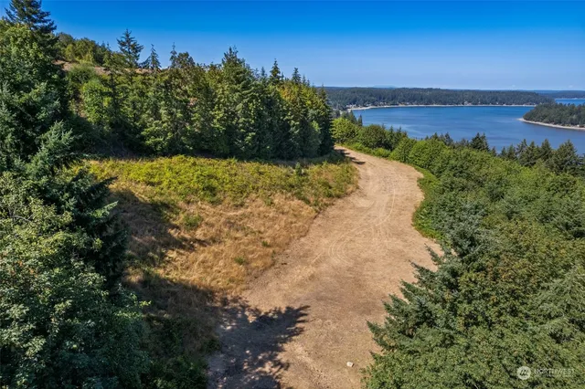 a view of a road with a building in the background