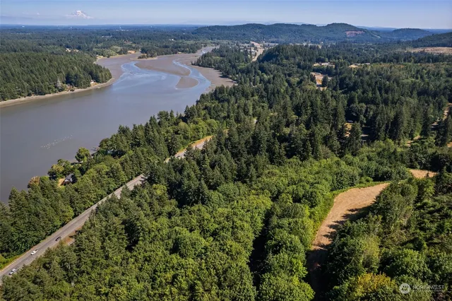an aerial view of beach and residential houses with outdoor space