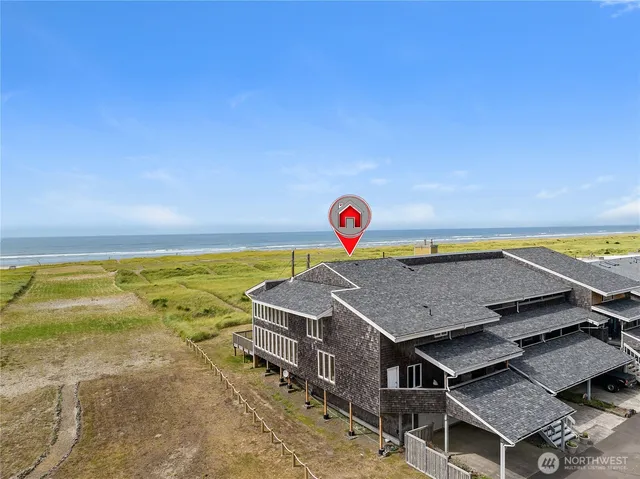 a view of a terrace with a table and chairs