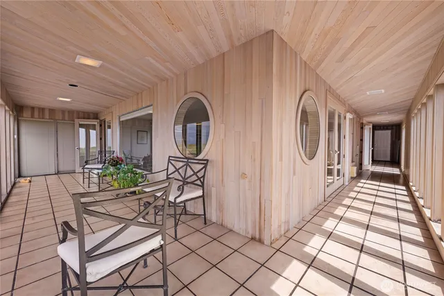 a view of a hallway with seating area