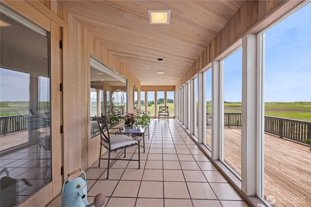 a lobby with furniture and floor to ceiling window