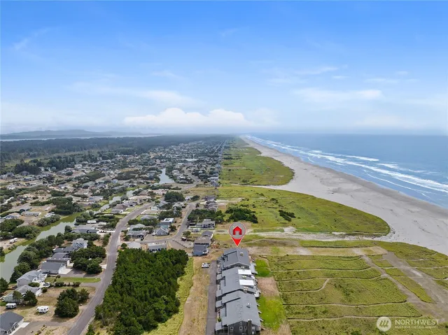 an aerial view of residential houses with outdoor space