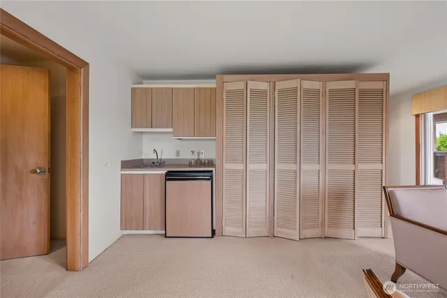 a view of a kitchen with appliances and cabinets