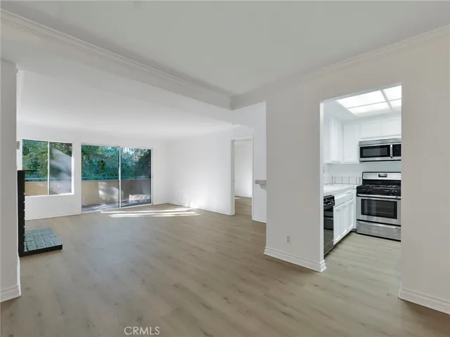 a kitchen with a sink and stainless steel appliances
