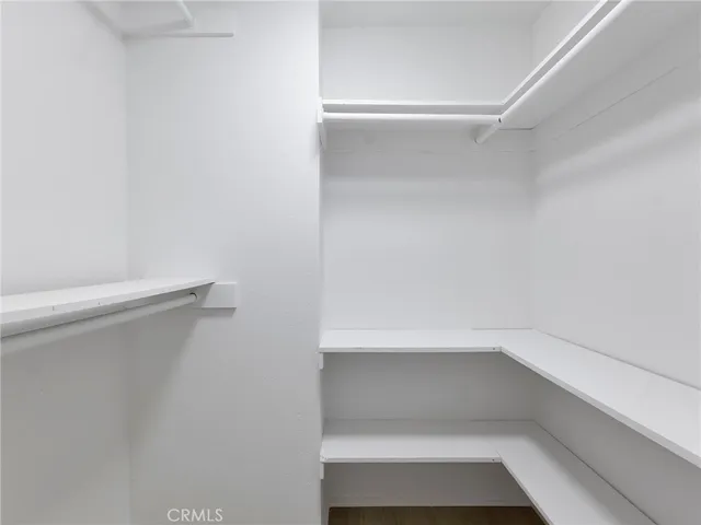 a bathroom with a sink double vanity granite tub shower and a mirror