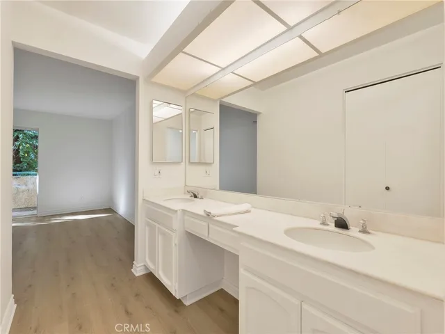 a bathroom with a granite countertop toilet and a shower