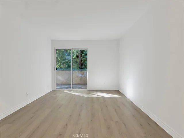 a backyard of a building with lots of trees