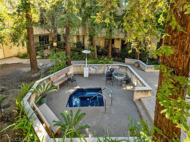 a view of balcony with furniture and garden