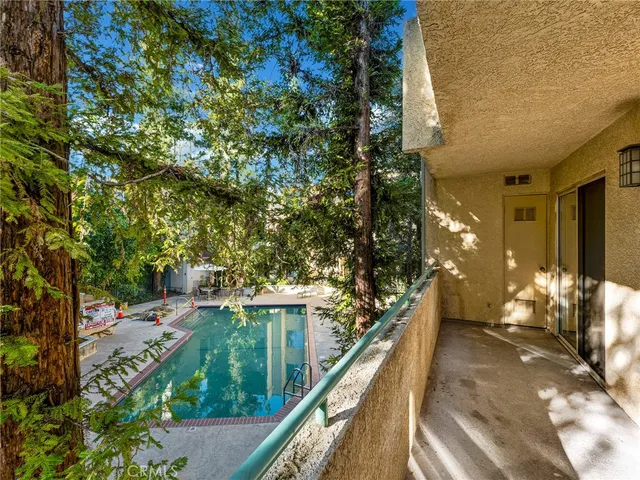 an aerial view of a houses with a yard
