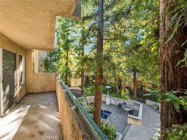 an aerial view of a houses with a yard