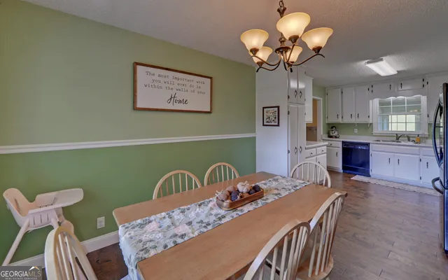 a kitchen with stainless steel appliances a refrigerator sink and cabinets