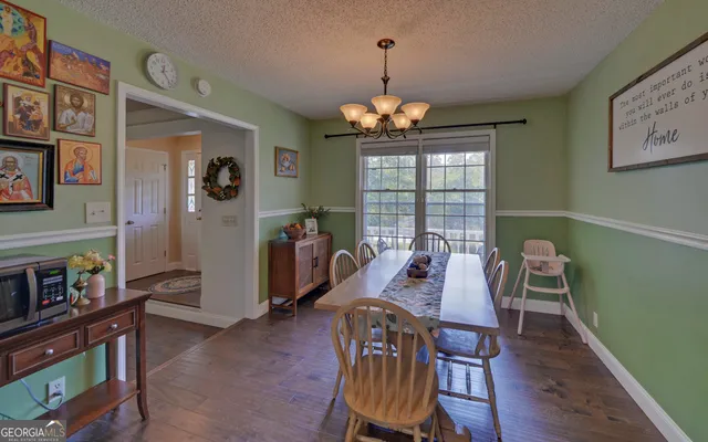 a kitchen with granite countertop stainless steel appliances and a refrigerator