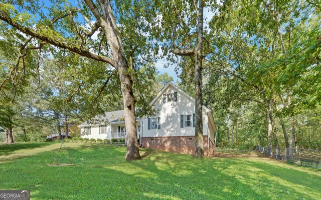 front view of a house with a tree