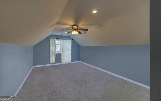 a view of empty room with stairs