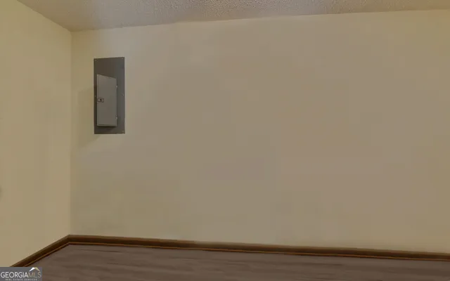 a view of a house with backyard sitting area and garden