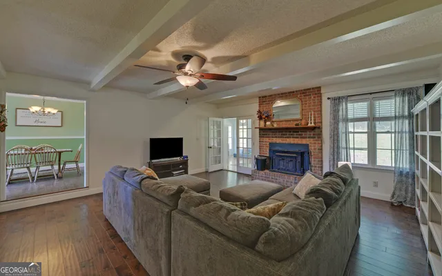 a living room with furniture and a window
