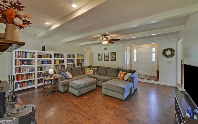 a very nice looking living room with furniture and a window
