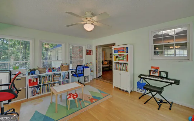 a view of a dining room with furniture window and wooden floor